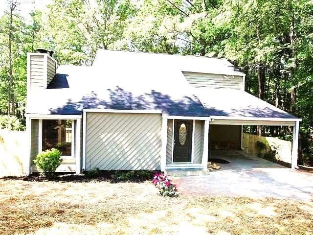 215 Carmichael Rd, Woodstock, GA 30189 - view of front of house with a chimney