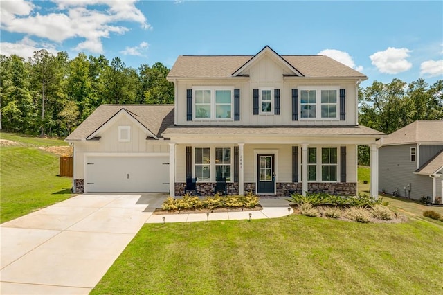 craftsman-style house with a front lawn, covered porch, and a garage