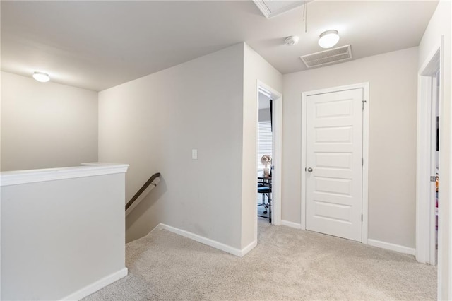 corridor with light carpet