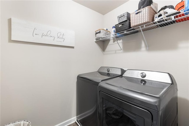 clothes washing area featuring washing machine and dryer