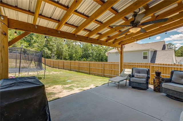 view of patio featuring ceiling fan and a trampoline