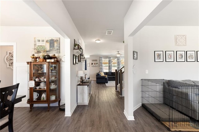 hallway with dark wood-type flooring