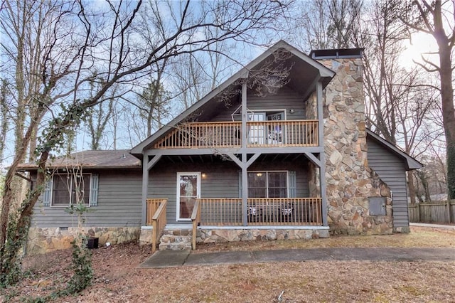 view of front of home featuring a balcony