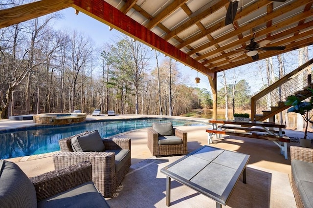 view of patio / terrace featuring a ceiling fan, a pool with connected hot tub, an outdoor living space, and stairs