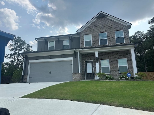 495 Sterling Creek Way, Loganville, GA 30052 - craftsman-style home with brick siding, concrete driveway, a front yard, and board and batten siding