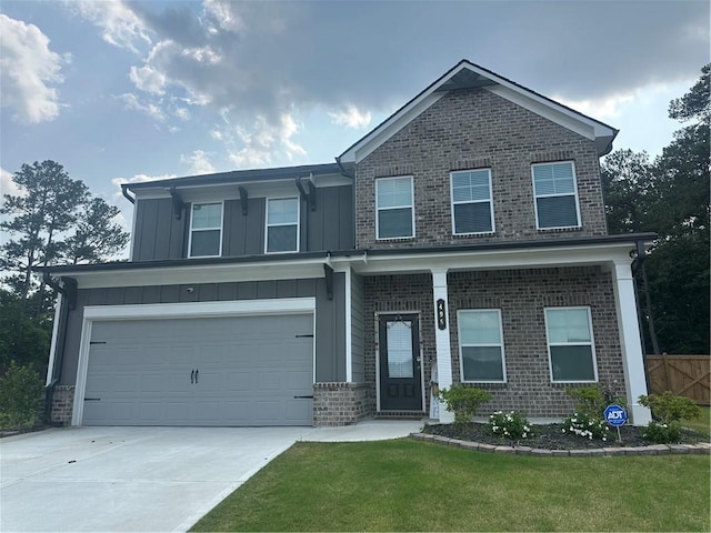 495 Sterling Creek Way, Loganville, GA 30052 - craftsman-style house with driveway, brick siding, board and batten siding, and an attached garage