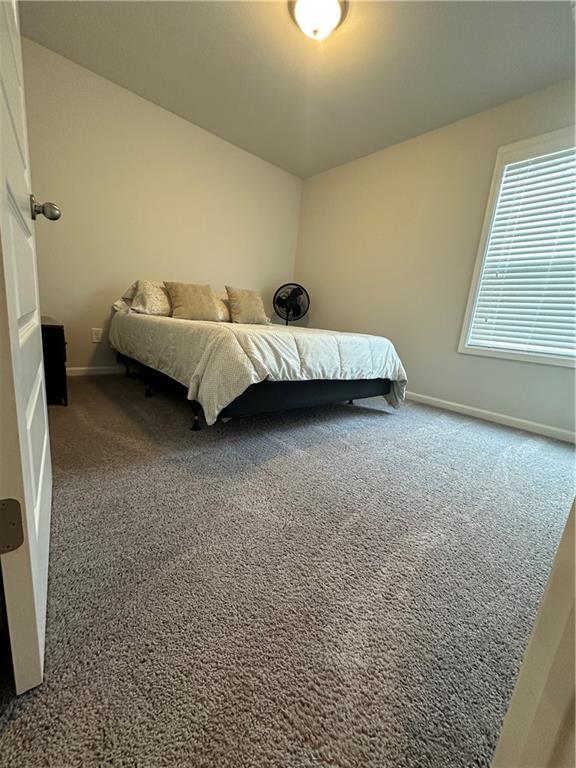 495 Sterling Creek Way, Loganville, GA 30052 - bedroom with carpet floors and baseboards