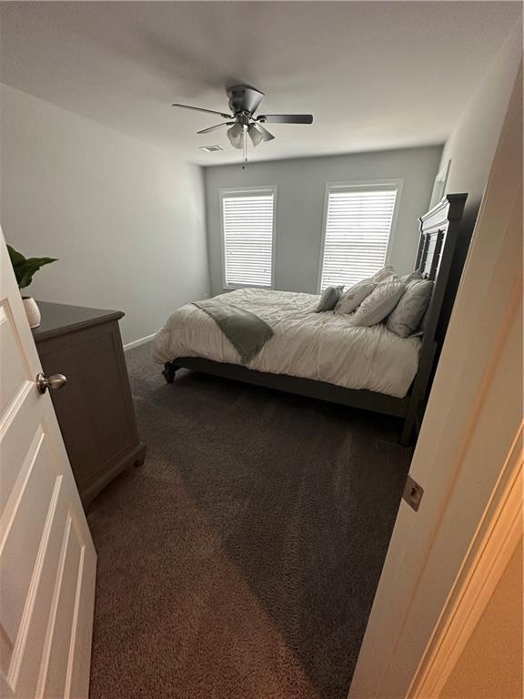 495 Sterling Creek Way, Loganville, GA 30052 - carpeted bedroom with baseboards