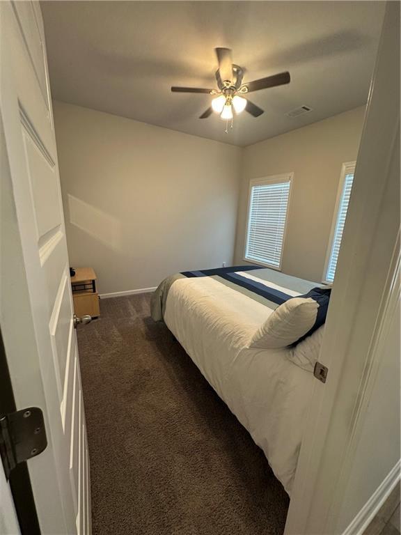 495 Sterling Creek Way, Loganville, GA 30052 - bathroom featuring wood finished floors and curtained shower