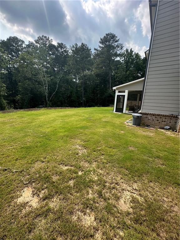 495 Sterling Creek Way, Loganville, GA 30052 - sunroom / solarium featuring a ceiling fan, vaulted ceiling, outdoor lounge area, and view of scattered trees