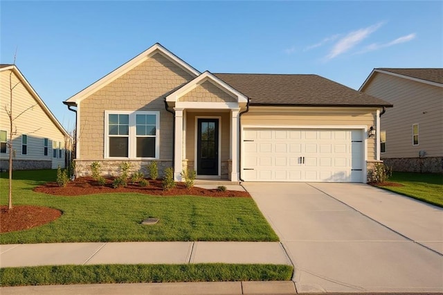1783 Juniper Berry Way, Loganville, GA 30052 - craftsman house with stone siding, an attached garage, concrete driveway, and a front yard