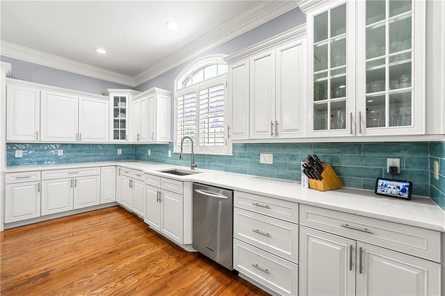 4080 Glen Hill Way NE, Marietta, GA 30066 - kitchen featuring stainless steel dishwasher, a sink, light countertops, white cabinets, and ornamental molding