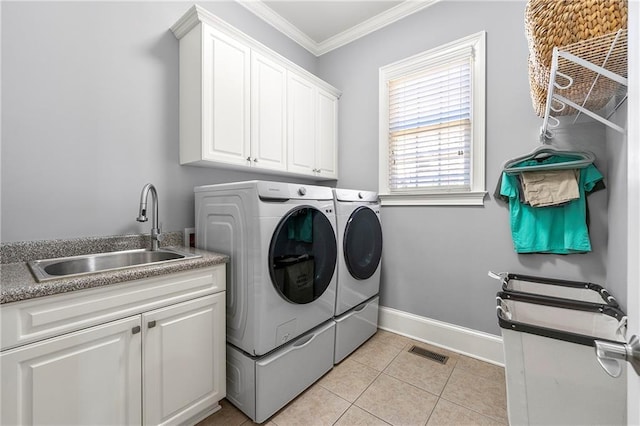 4080 Glen Hill Way NE, Marietta, GA 30066 - laundry area featuring independent washer and dryer, crown molding, cabinet space, light tile patterned floors, and baseboards