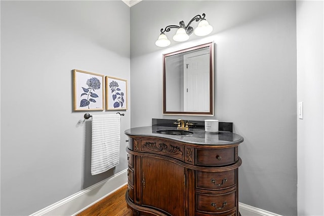 4080 Glen Hill Way NE, Marietta, GA 30066 - bathroom featuring baseboards, vanity, and wood finished floors