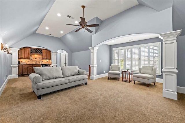 4080 Glen Hill Way NE, Marietta, GA 30066 - living room featuring ornate columns, light colored carpet, lofted ceiling, a ceiling fan, and arched walkways