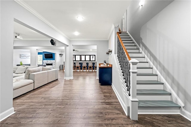 4080 Glen Hill Way NE, Marietta, GA 30066 - stairway featuring wood finished floors, ornamental molding, a fireplace, and baseboards