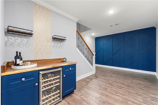4080 Glen Hill Way NE, Marietta, GA 30066 - indoor dry bar with beverage cooler, stairway, crown molding, baseboards, and light wood-type flooring