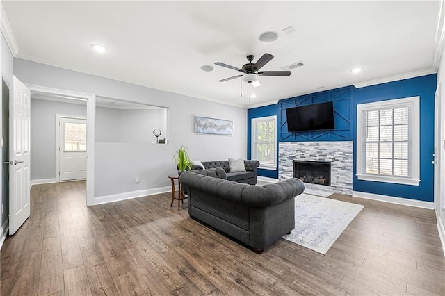 4080 Glen Hill Way NE, Marietta, GA 30066 - living area featuring ceiling fan, ornamental molding, baseboards, a tiled fireplace, and dark wood-type flooring