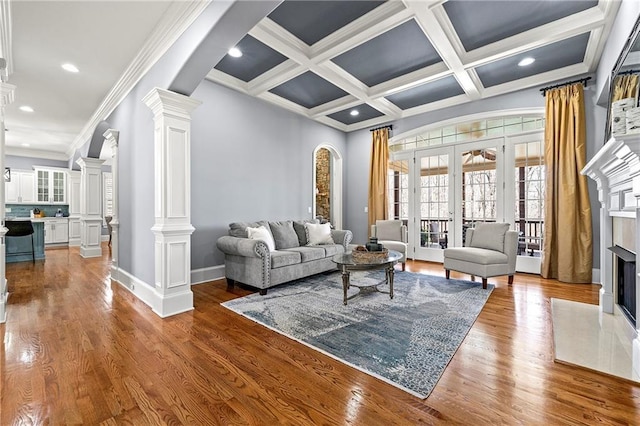 4080 Glen Hill Way NE, Marietta, GA 30066 - living area featuring ornate columns, french doors, a high end fireplace, recessed lighting, and wood finished floors