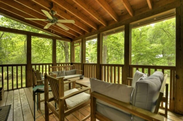 sunroom featuring a ceiling fan, plenty of natural light, and outdoor lounge area