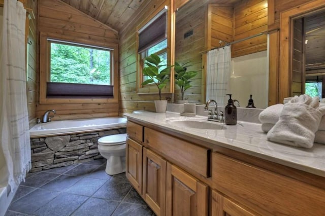 bathroom with vaulted ceiling, toilet, plenty of natural light, and wood walls