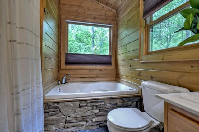 full bath with toilet, a relaxing tiled tub, lofted ceiling, and wood walls