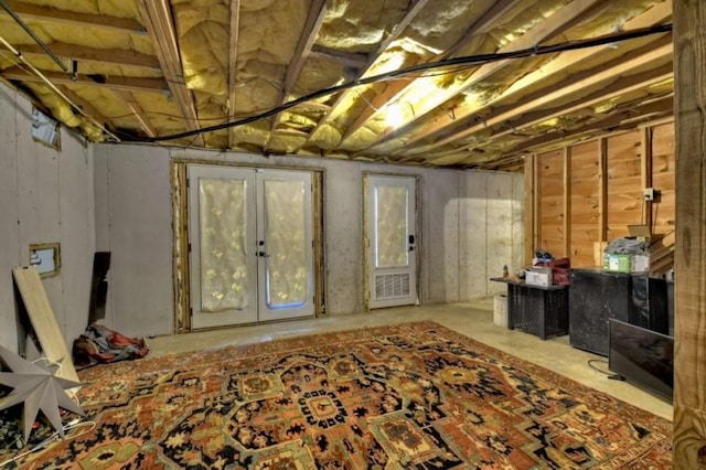unfinished basement featuring french doors