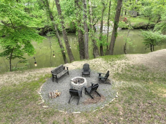 view of yard featuring an outdoor fire pit