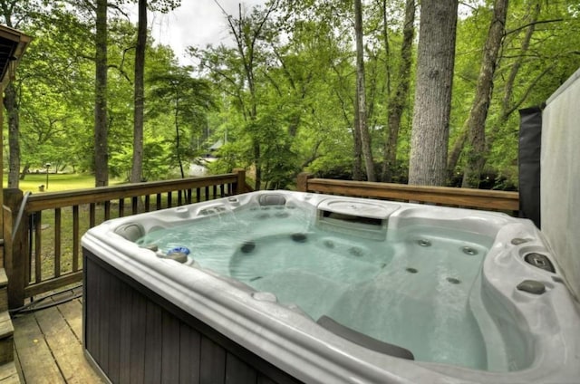 wooden terrace with a hot tub