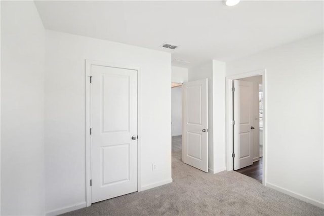 unfurnished bedroom with carpet