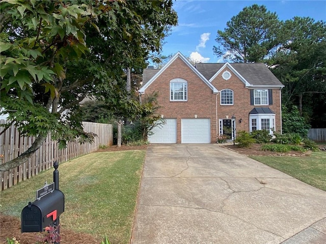 view of front of property with a front lawn and a garage