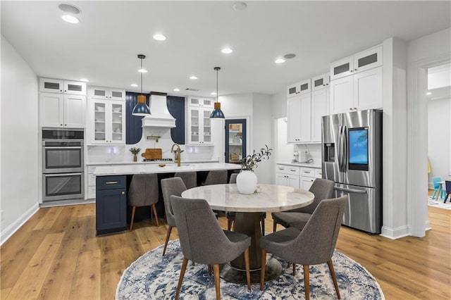 2013 White Cypress Ct, Smyrna, GA 30082 - dining area featuring light wood-style floors, baseboards, and recessed lighting