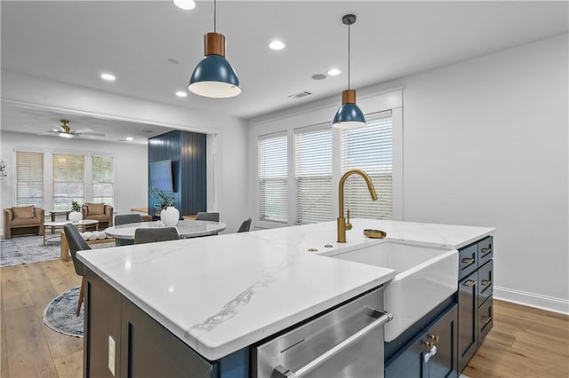 2013 White Cypress Ct, Smyrna, GA 30082 - kitchen featuring dishwasher, light wood-style flooring, a sink, an island with sink, and recessed lighting
