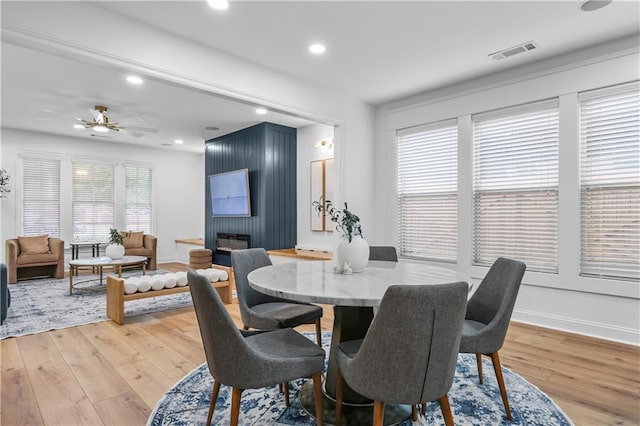2013 White Cypress Ct, Smyrna, GA 30082 - dining space with light wood finished floors, recessed lighting, a ceiling fan, a fireplace, and baseboards