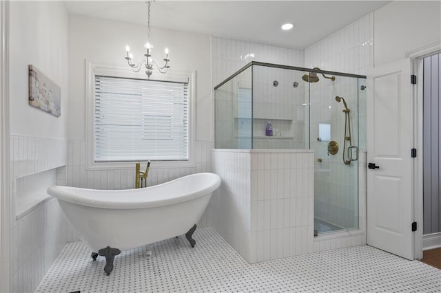 2013 White Cypress Ct, Smyrna, GA 30082 - bathroom featuring a chandelier, a soaking tub, a shower stall, and wainscoting