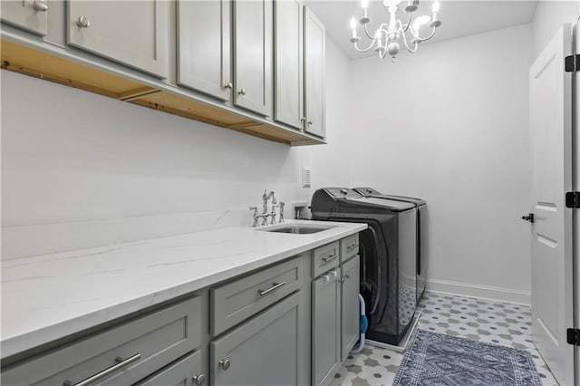 2013 White Cypress Ct, Smyrna, GA 30082 - laundry room featuring light floors, cabinet space, washer and clothes dryer, baseboards, and a chandelier