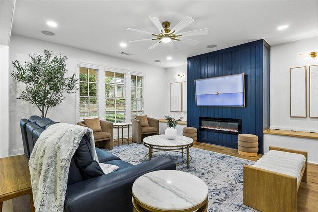 2013 White Cypress Ct, Smyrna, GA 30082 - living area featuring wood finished floors, a ceiling fan, recessed lighting, and a large fireplace