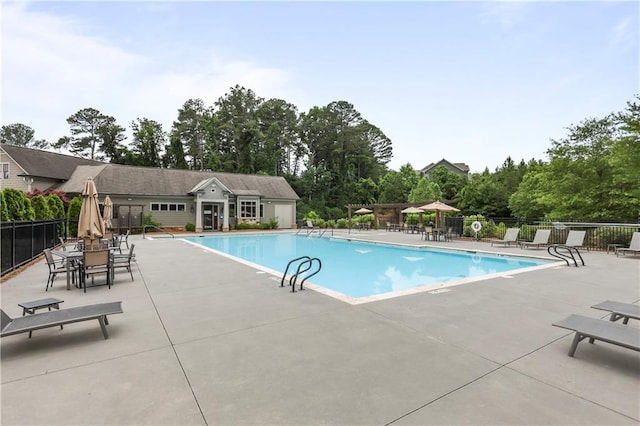 2013 White Cypress Ct, Smyrna, GA 30082 - community pool with a patio and view of wooded area
