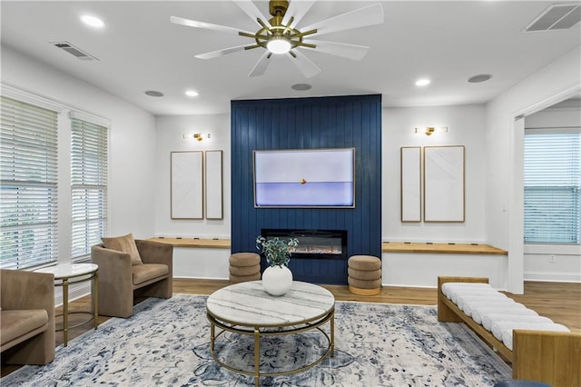 2013 White Cypress Ct, Smyrna, GA 30082 - living area featuring wood finished floors, recessed lighting, a ceiling fan, baseboards, and a large fireplace
