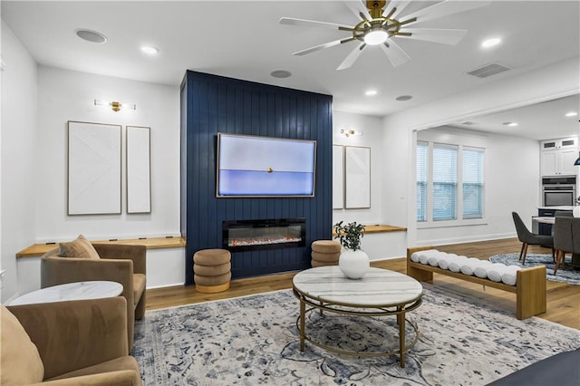 2013 White Cypress Ct, Smyrna, GA 30082 - living room featuring wood finished floors, a fireplace, ceiling fan, recessed lighting, and baseboards