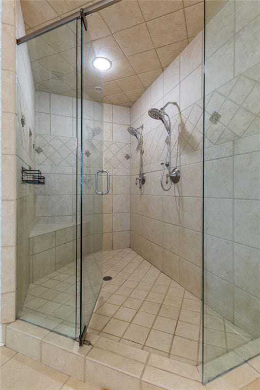 bathroom featuring a stall shower and tile patterned floors