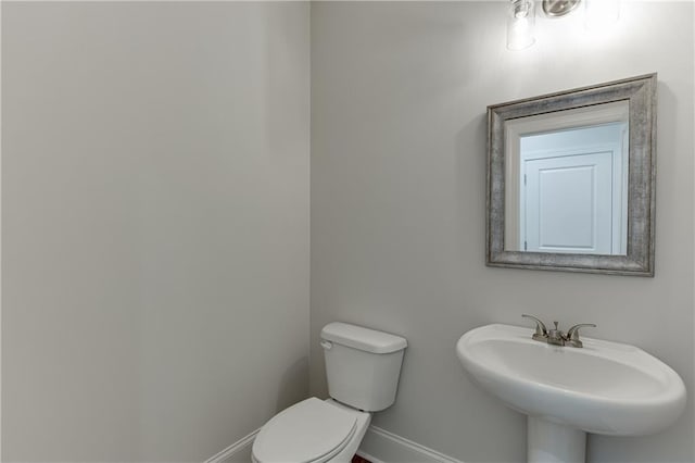 bathroom featuring sink and toilet