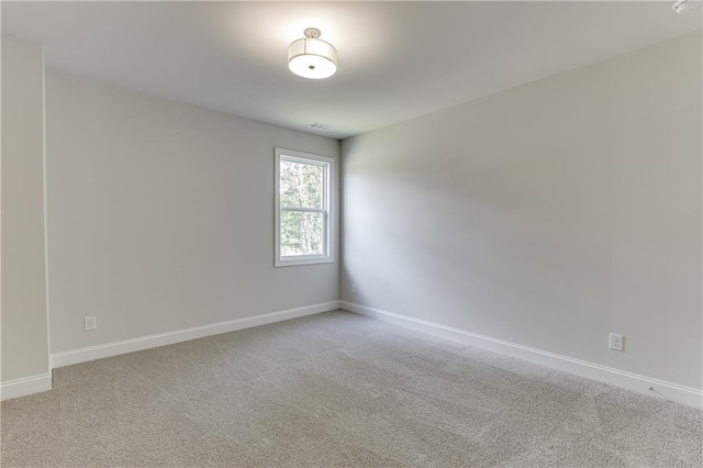 unfurnished room with carpet floors