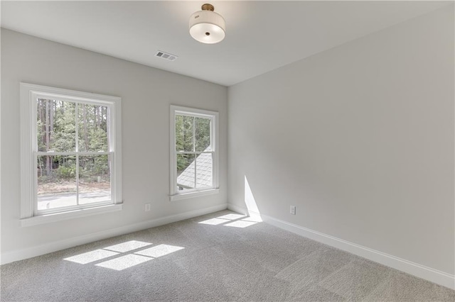 spare room featuring carpet flooring