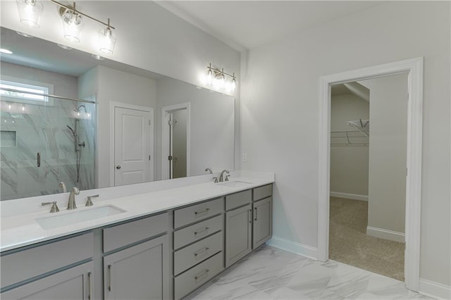 bathroom with vanity and a shower with door