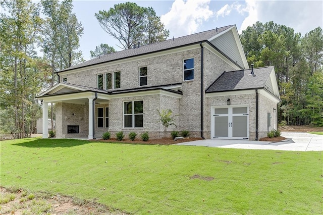 view of front of home featuring exterior fireplace and a front yard