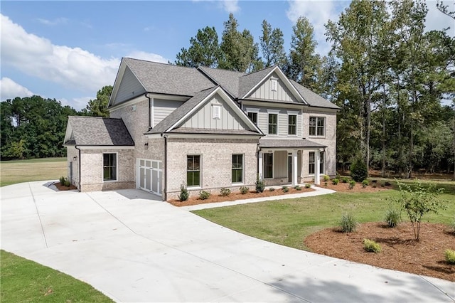 view of front of home with a front lawn, a porch, and a garage