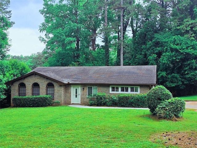 2821 NE Meadowlark Trl, Duluth, GA 30096 - ranch-style house with brick siding, a front yard, and a shingled roof