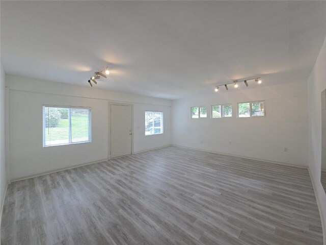 2821 NE Meadowlark Trl, Duluth, GA 30096 - empty room with rail lighting and wood finished floors
