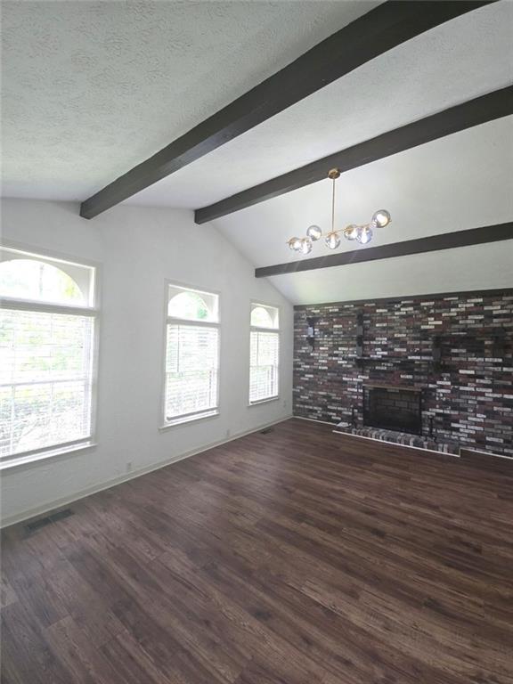 2821 NE Meadowlark Trl, Duluth, GA 30096 - unfurnished living room with a fireplace, wood finished floors, a textured ceiling, and baseboards